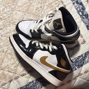 Nike Black and White Shoes with Gold Details